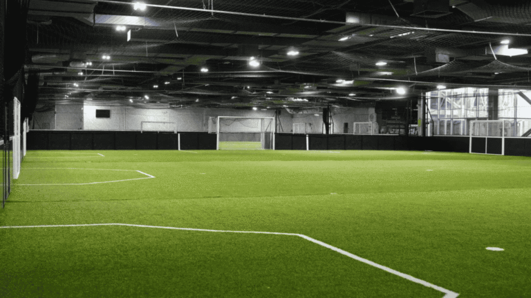 Empty indoor soccer field before a training session